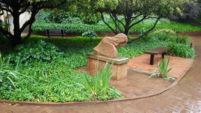 Women washing her hair statue